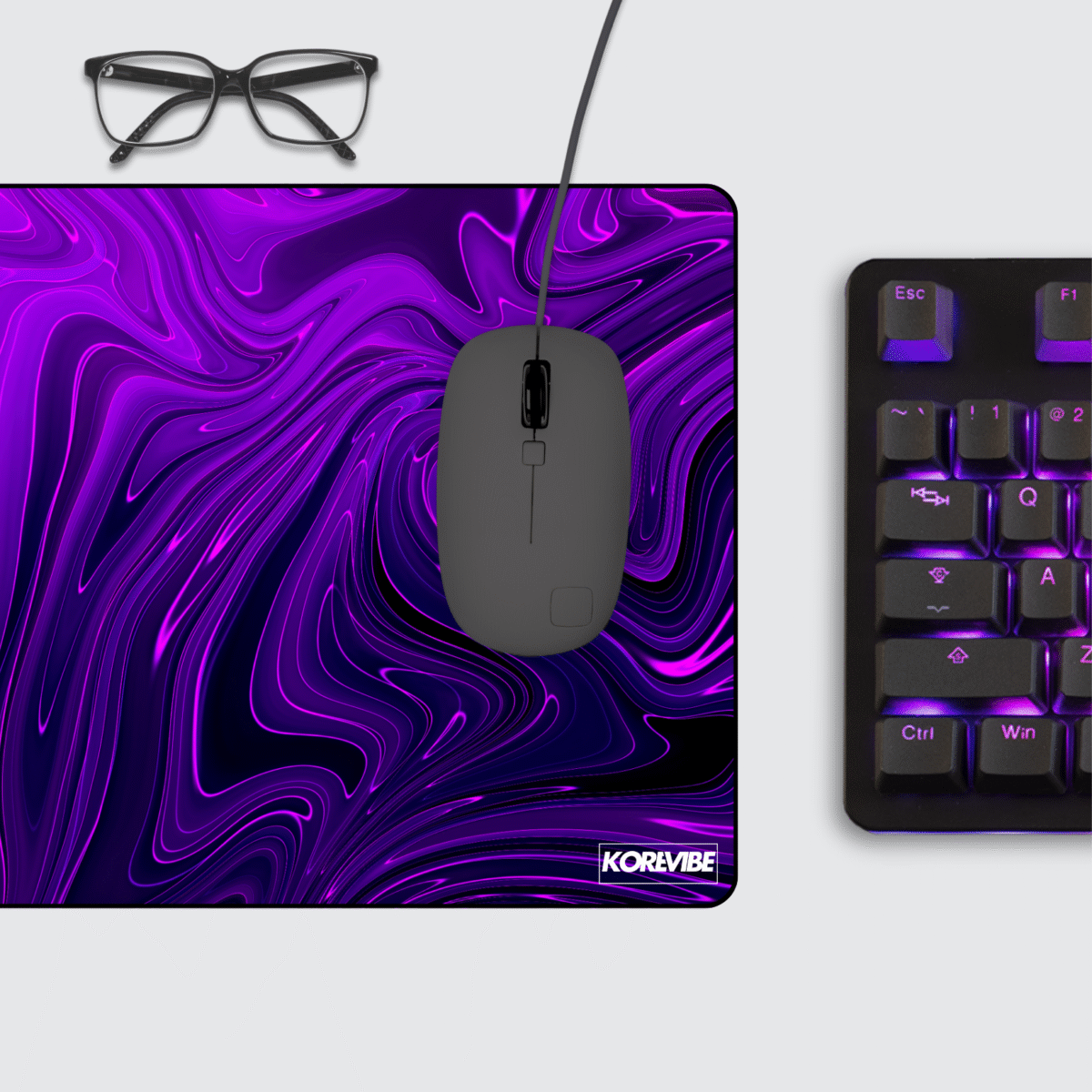Fluid Abstract Gaming Mouse Pad on desktop – modern violet swirl design for gamers and creators