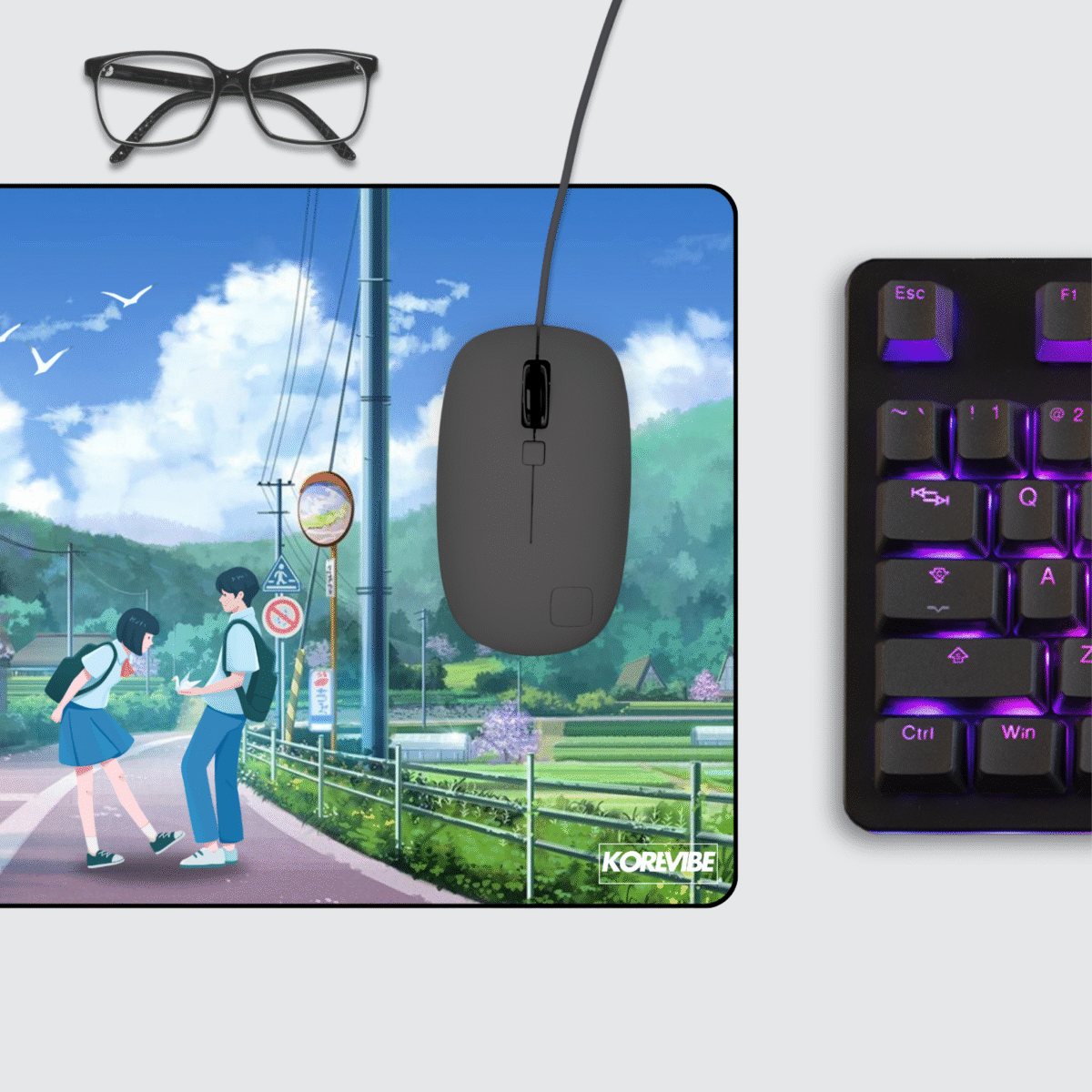 Large anime gaming mouse pad on desk setup with keyboard and mouse – Japanese cherry blossom art aesthetic.