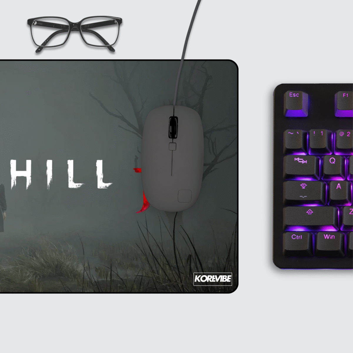 Silent Hill F gaming mouse pad on desktop setup with keyboard and mouse – horror-inspired art for gaming workspace.