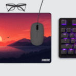 Sunset Minimalist Gaming Mouse Pad on desk setup – retro synthwave sunset lake vector art aesthetic with keyboard and mouse.